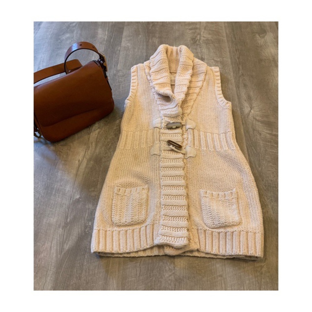Beautiful cream sweater vest with toggles.